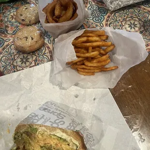 Cookies, onion rings, French fries, and grilled chicken sandwich.