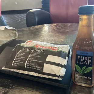 Sandwich still wrapped and drink