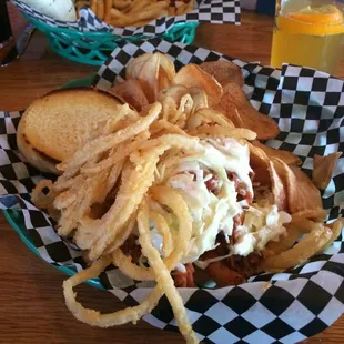 Pulled pork sandwich with chips.