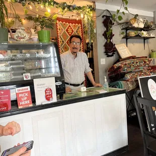 Hamada, the owner behind the counter