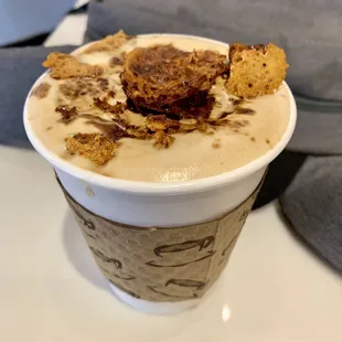 a cup of coffee with a crumb topping