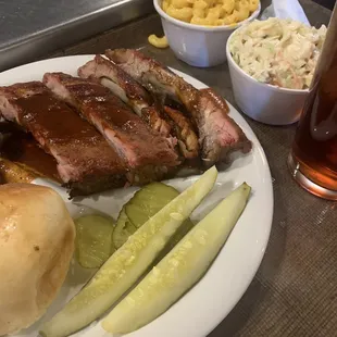 a plate of meat and sides