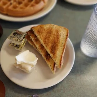 a plate of waffles and a cup of coffee