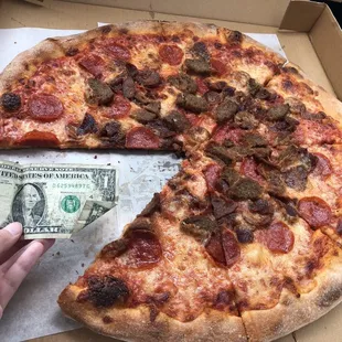 Heavy Weight Pizza Next to dollar for size comparison