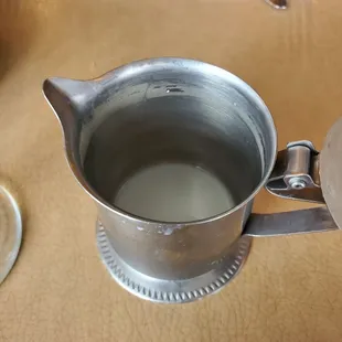 A dirty milk saucer. The old milk was easily scraped off by my finger nail. Didn&apos;t notice it until I already consumed it in my oatmeal.