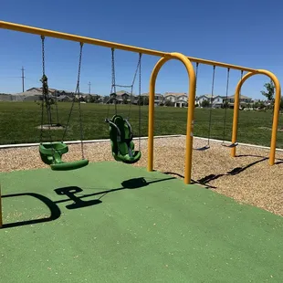 2 regular swings, 1 accessible swing, 1 tandem toddler swing