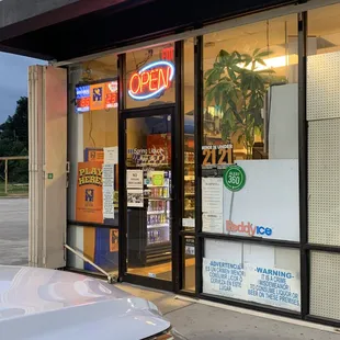 a storefront with a car parked in front of it