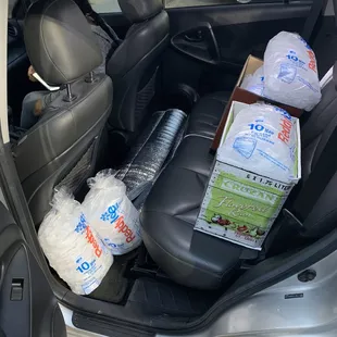 the inside of a car filled with bottled water