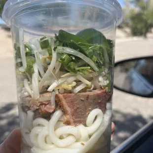 Spring Rollin'.  Ingredients for throwing in the Pho broth.  Smoked brisket, Udon noodles, jalapenos, basil, cilantro, bean sprouts, 2 limes