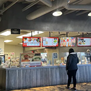  two people standing in front of the counter