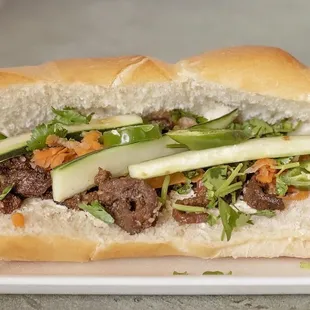  a sandwich with meat and vegetables