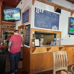 a man standing at the bar
