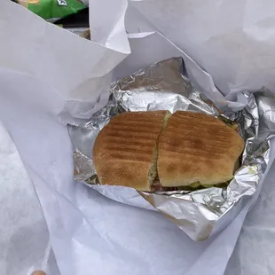 a sandwich wrapped in foil