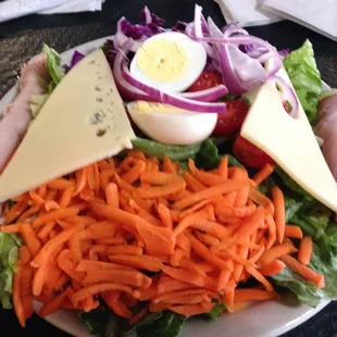 Chef salad. One piece of turkey &amp; ham lunchmeat rolled up. Lots of carrots &amp; red cabbage.