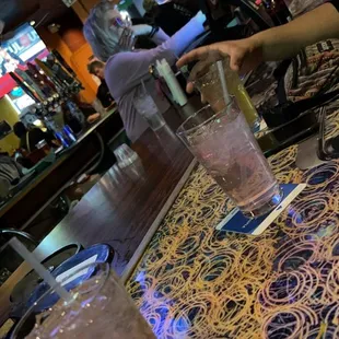 a woman pouring a drink