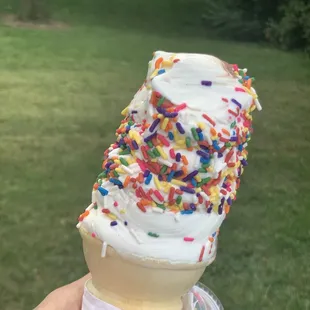 an ice cream cone with sprinkles