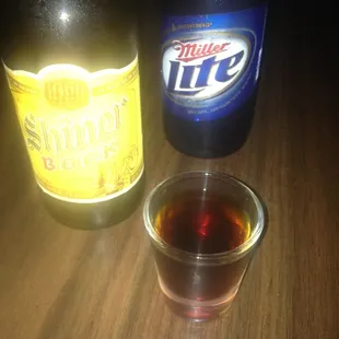 a bottle of miller&apos;s life and a shot of miller&apos;s life