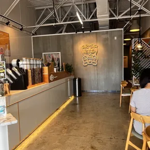 people sitting at tables in a cafe