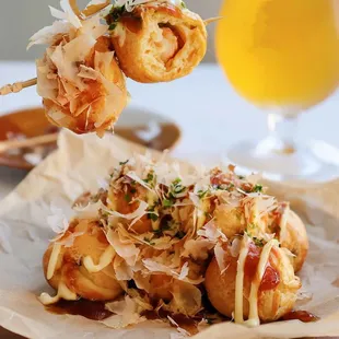 a plate of food and a glass of beer