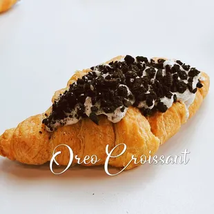 a croissant with black cavia