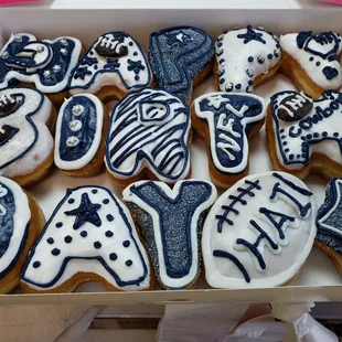 a box of decorated doughnuts