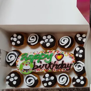 a box of decorated donuts