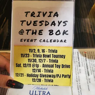 a hand holding a ticket