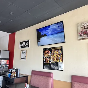 the seating area with a flat screen tv
