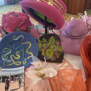 A photo of the Vogue photographer taking a picture of a model wearing a Margie Trembley Chapeaux hat at the Kentucky Derby