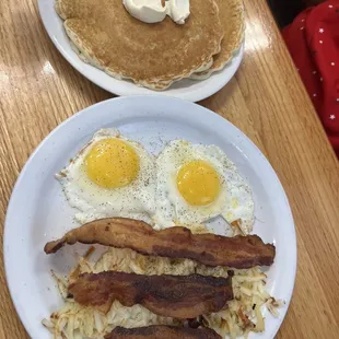 Eggs and bacon with pancakes.