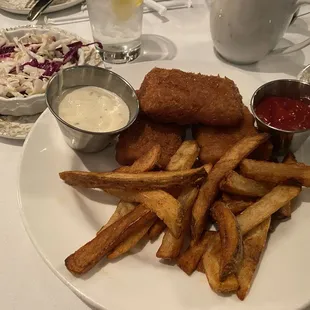 Haddock dinner with fries and homemade coleslaw