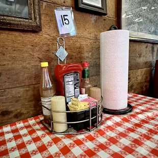 a table with a red and white checkered tablecloth