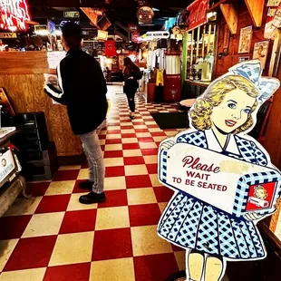 a woman holding a sign