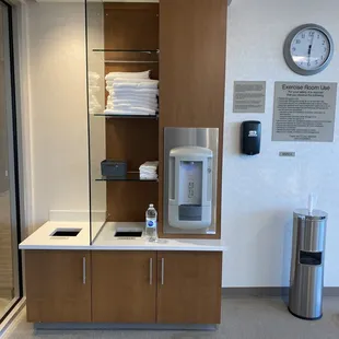 Clean towels, filtered water, and sanitizing wipes at the 24/7 fitness center...