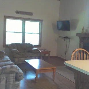 Whispering Pines Cabin: Open Plan Living Room with Dish TV and Wood Burning Fireplace