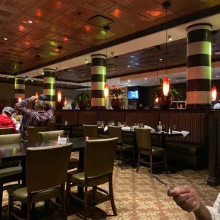 a man sitting at a table in a restaurant