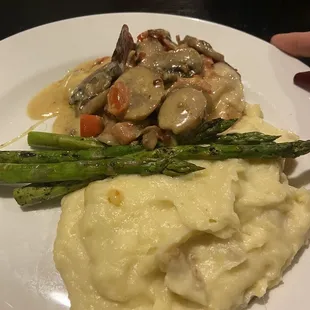 Smothered chicken mashed potatoes grilled asparagus