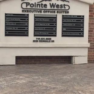 The sign in front of the building.