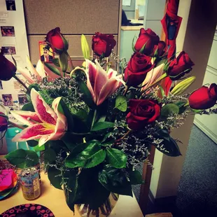 A fantastic surprise from my husband, Adam! Red roses and stargazer lilies. Courtesy of a little poetic license from the owner.