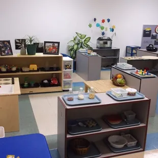 Classroom Montessori learning stations are well organized and attractively displayed to invite children to participate.
