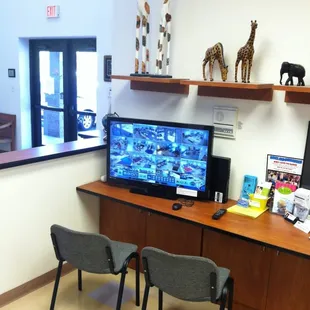 Parents are invited to sit and view their child&apos;s class using visual communication monitors in the front office area.