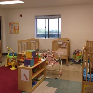 The infant room is attractive and inviting, giving our infants a sense of security. Parents are always invited to participate.