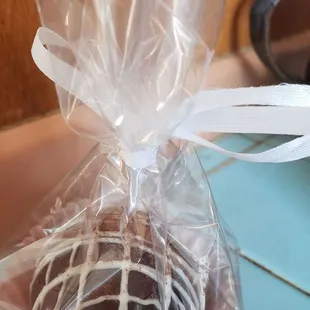 a chocolate truffle wrapped in plastic wrap