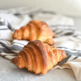 two croissants on a towel