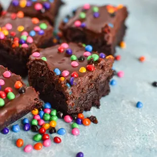 chocolate brownies with chocolate frosting and sprinkles