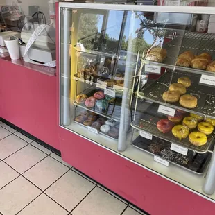 a display of sprinkles and donuts