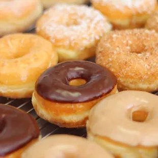 Sprinkles Donuts' light and fluffy raised glaze donuts come in: regular glaze, chocolate, maple, cinnamon crunch and coconut