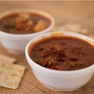 two bowls of soup and crackers