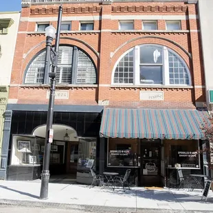 a brick building with awnings