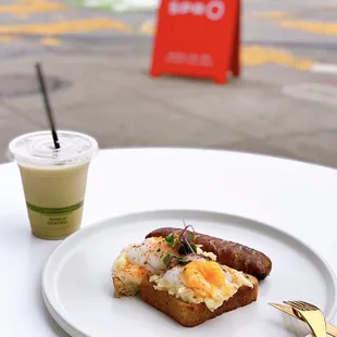 Mash Up w/ sous-vide eggs, togarashi, chives, creamy truffle parmesan potato purée, buttered sourdough ($12+$3 sausage) &amp; Hoji Latte ($5)